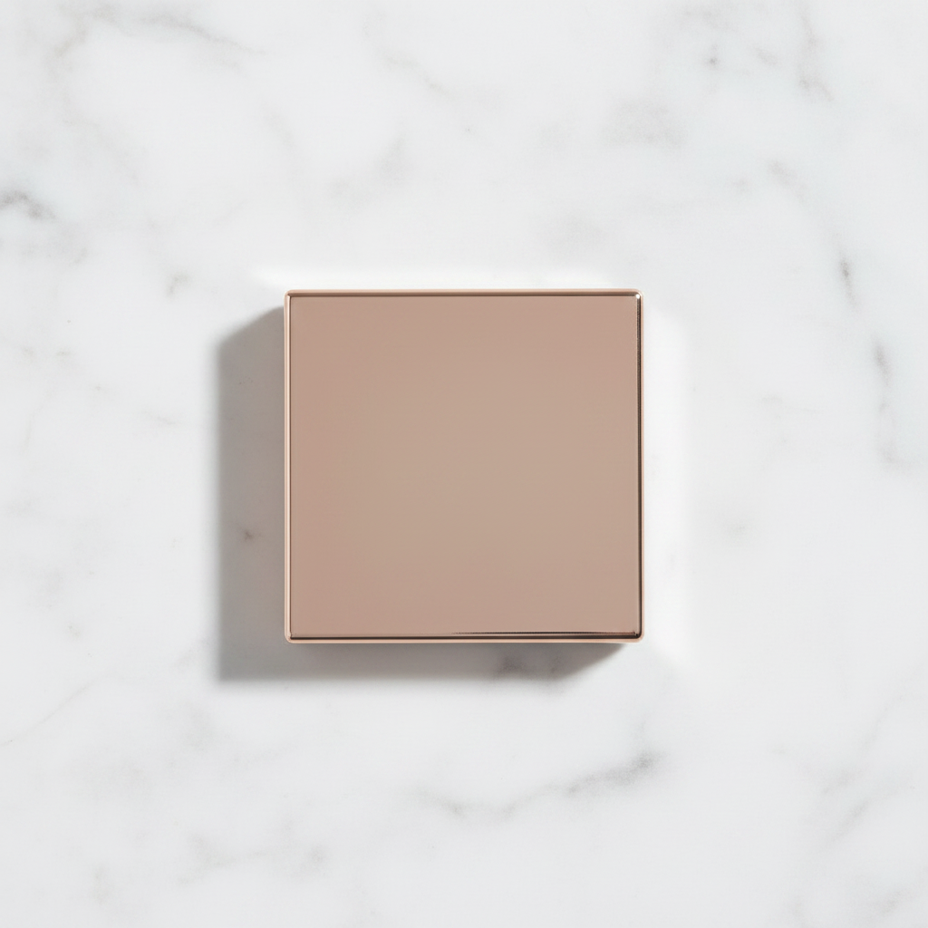 Rose gold compact closed – top view flat lay