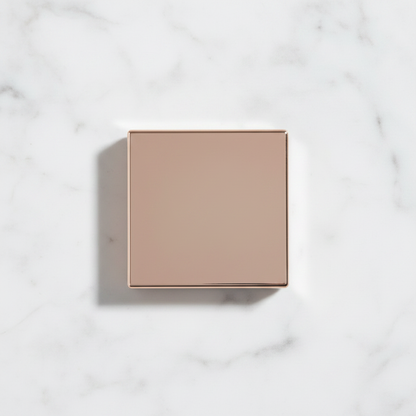 Rose gold compact closed – top view flat lay